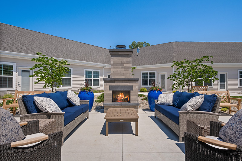 Quincy Place Outdoor Fireplace with furniture