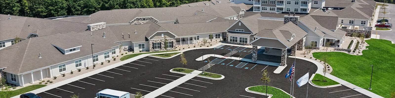 Aerial view of the Quincy Place Senior Living campus and parking lot