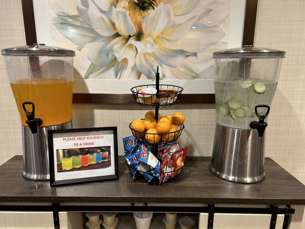 A fully stocked hydration station is set up in the common areas. This is a gentle reminder to residents to eat and drink regularly, and a welcoming snack for visitors. Quincy Place Senior Living.