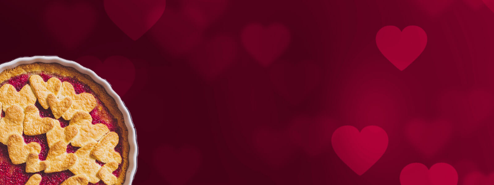 Red background with Valentine's Day hearts and pie in the corner